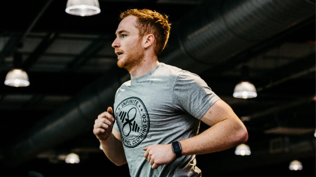 man practicing movement by running on a treadmill in a gym